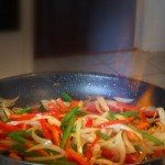 Flambeing Peppers and Onions