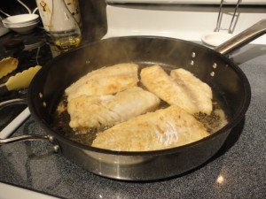 Fish Filets Frying In Skillet