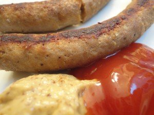 Grilled Homemade Hot Dogs with Mustard and Ketchup on a Plate