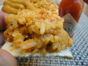 Saltine Cracker Topped with Crawfish Boudin and Hot Sauce