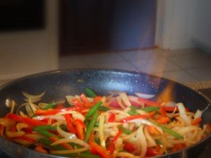 Flambeing Peppers and Onions